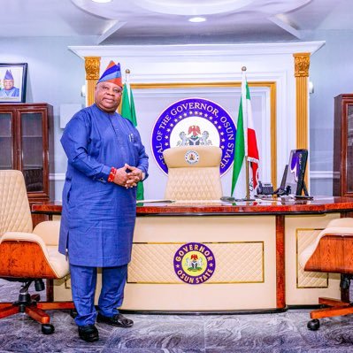 Governor Ademola Adeleke posing for an official photo in front of the Osun State Governor's table