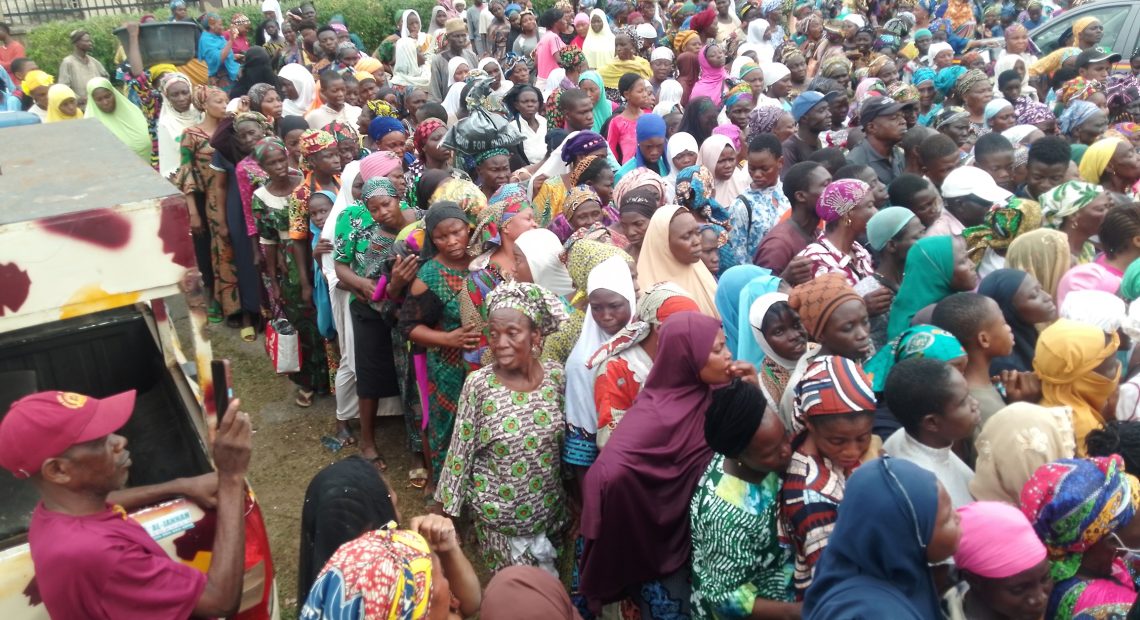 Some residents of Ibadan who received food items, school bags and cash gifts as part of Oba Rasheed Ladoja's giving back to society